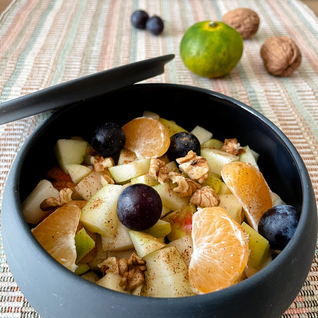 A fruit salad with spicy and tangy flavors.